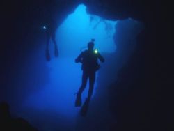 Divers at the entrance to Blue Hole cave,Gozo. by Ian Palmer 